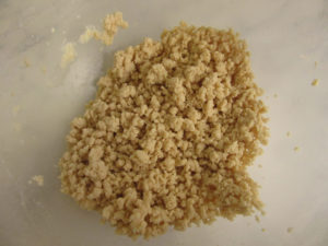 Breadcrumb mix with water added, then whisked to make bigger clumps.