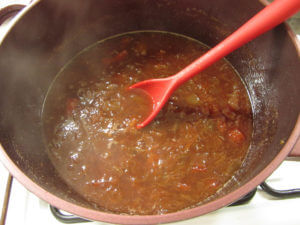 Rhubarb marmalade cooking in a pan.